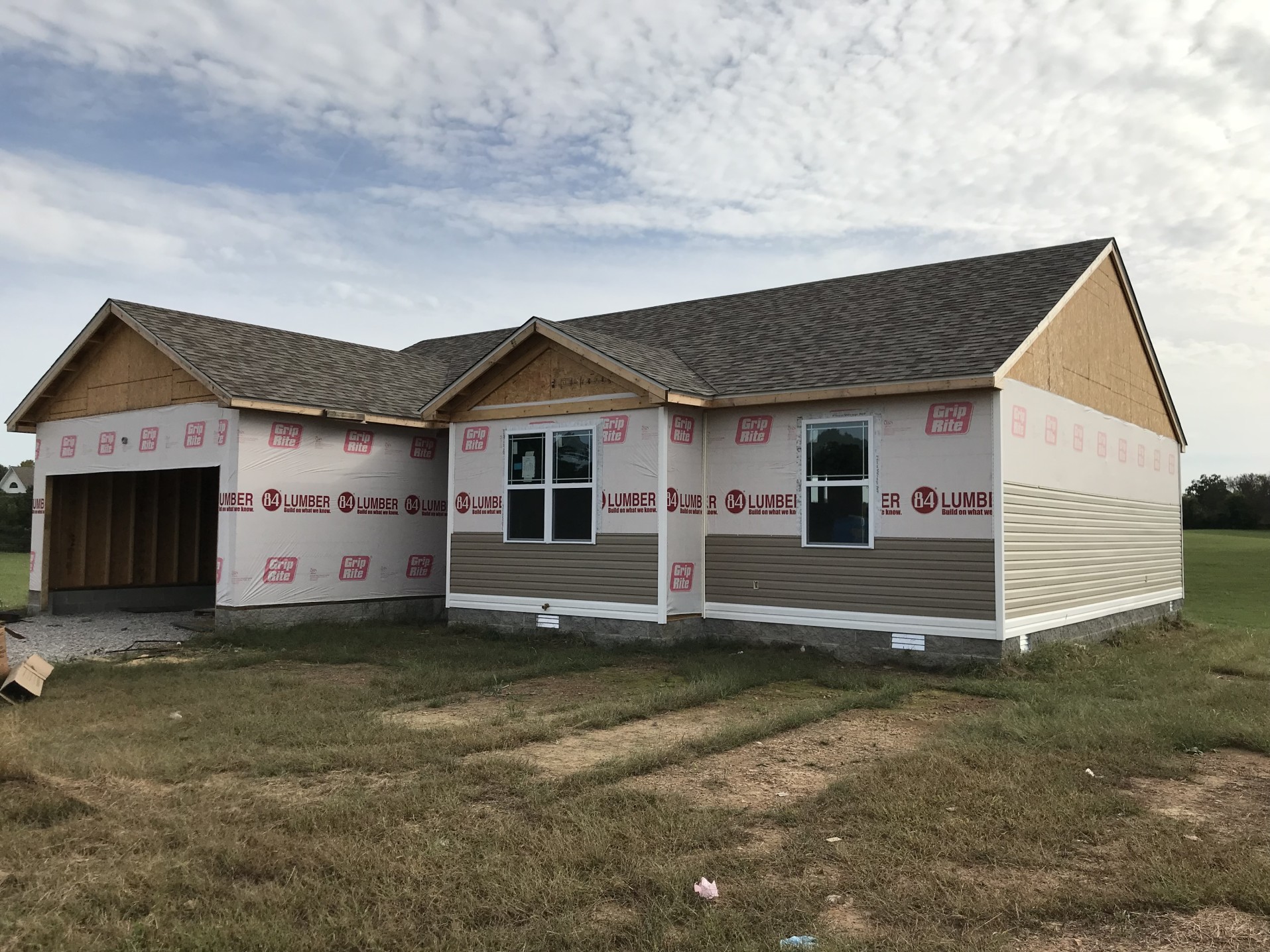 What To Know About The Cost Of Vinyl Siding Deely House   Tyvek New Construction Contractor Vinyl Siding Family Dream Building Under Construction Building Boom T20 PWjykY 